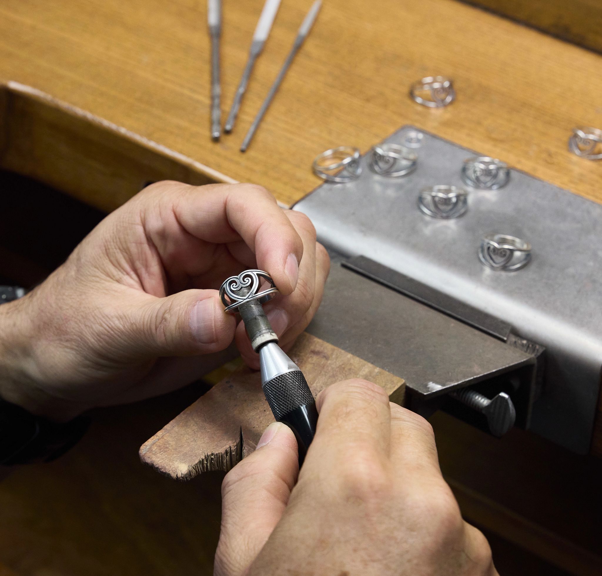 Artisan Polishing a Sterling Silver Traced Lines Ring 